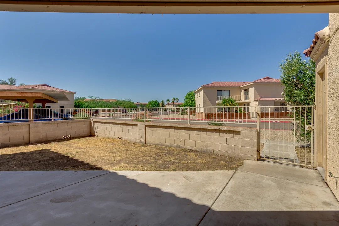 A cleared, debris-free backyard after a junk haul in the Phoenix area