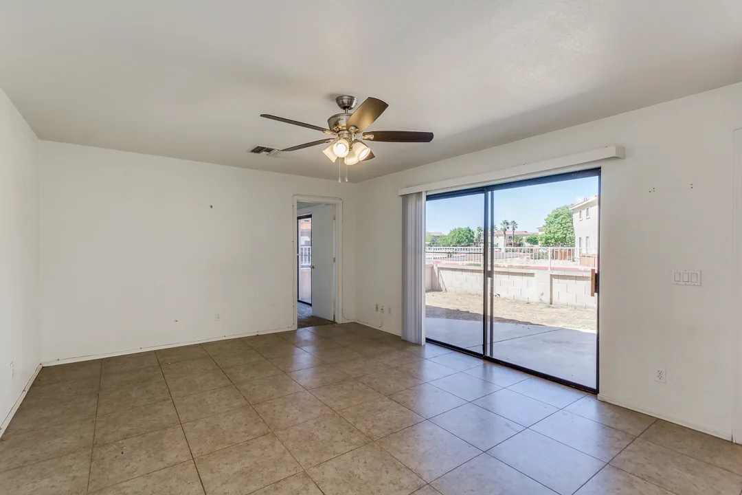 A cleared, broom-swept living room in a Phoenix home, ready to list